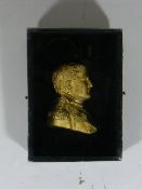 A Gilt Metal Silhouette Of Napoleon In Glass Front