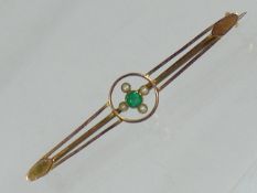An Antique Gold Brooch Set With Emerald & Seed Pea