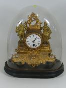 A 19thC. French Gilt Clock In Glass Dome