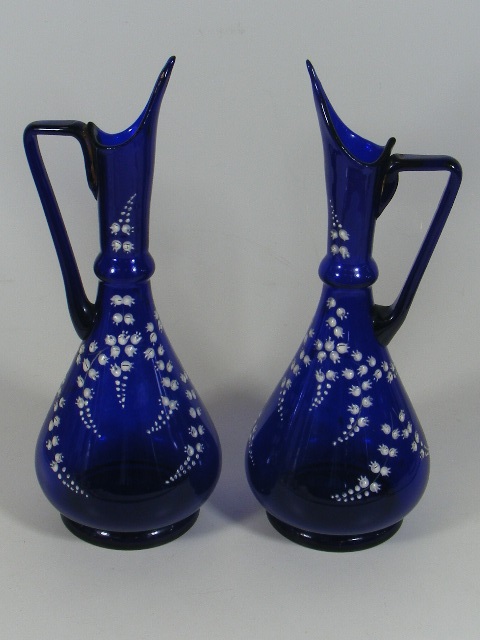 A Pair Of 19thC. Bristol Blue Style Glass Ewers