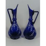 A Pair Of 19thC. Bristol Blue Style Glass Ewers