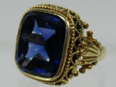 An Ornate Ladies 18ct Gold Ring With Large Blue St