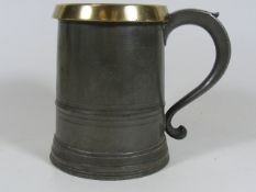 An Antique Brass Topped Pewter Quart