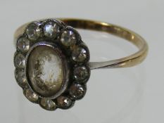 A Ladies Gold Ring With White Stones