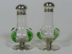 Two Art Nouveau Silver Topped Peppers