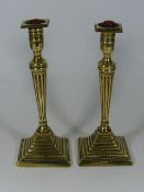 A Pair Of Georgian Brass Candlesticks