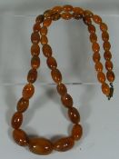 A Vintage Set Of Amber Style Beads