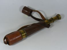 A Leather Cased Three Draw Telescope