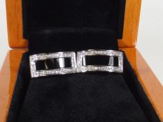 A Pair Of Gents White Metal & Diamond Cuff Links