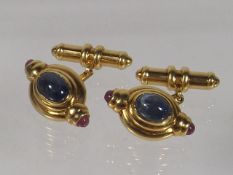 An 18ct Gold Pair Of Cuff Links Set With Cabochon