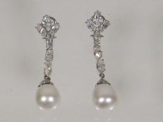 A Pair Of Ladies 14ct White Gold Ear Rings Set Wit