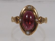 An Antique Yellow Metal Garnet & Pearl Ring