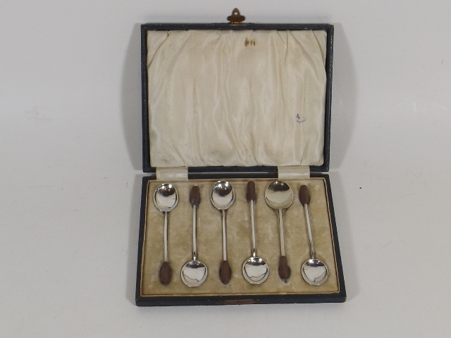 A Cased Set Of Coffee Bean Style Silver Teaspoons