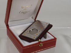 A Cartier Gold & Stainless Steel Cigar Cutter With