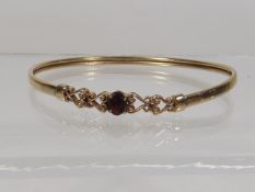 A Ladies 9ct Gold Bangle With Garnet Stone Approx.