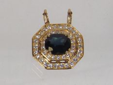 An 18ct Gold Diamond & Sapphire Pendant