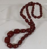 A Large Set Of Bakelite Cherry Amber Beads