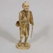 A Meiji Period Japanese Ivory Figure Of Male With