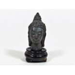 A Small Bronze Oriental Goddess Bust On Rosewood P