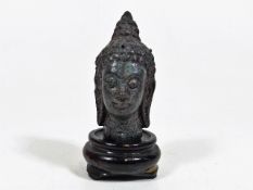 A Small Bronze Oriental Goddess Bust On Rosewood P
