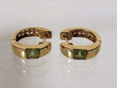 A Ladies Set Of 14ct Gold Ear Rings With Peridot