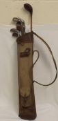 A Vintage Golf Bag With Hickory Clubs