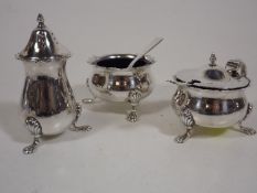 A Silver Cruet Set With Two Silver Spoons