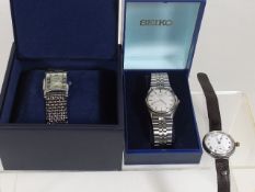 A Silver Wrist Watch Twinned With A Seiko & Avia W