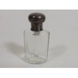 A Silver Topped Scent Bottle
