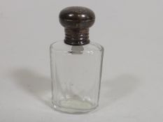 A Silver Topped Scent Bottle