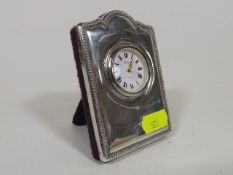 A Silver Mounted Travel Clock