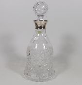 A Cut Glass Decanter With Silver Collar