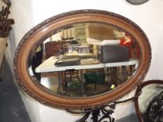 An Oak Framed Oval Mirror