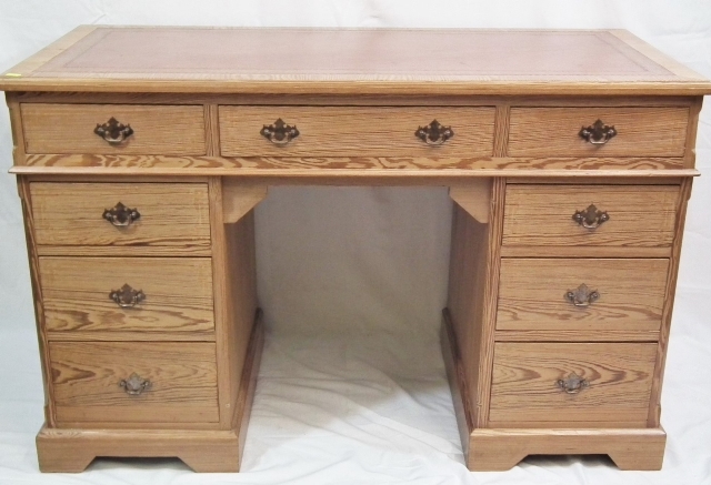 A Victorian Pitch Pine Writing Desk With Nine Draw
