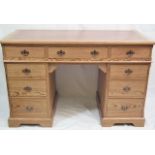 A Victorian Pitch Pine Writing Desk With Nine Draw