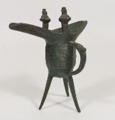 An Archaic Chinese Bronze Ritual Tripod Wine Vesse