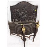 A Cast Iron Fire Grate With Dogs & Back Panel