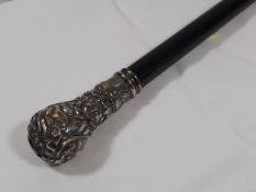 A Gents Robust Walking Cane With Heavily Embossed