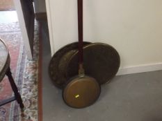 A Bed Warming Pan With Two Brass Trays