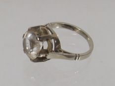 A Ladies Platinum Ring With Large White Stone