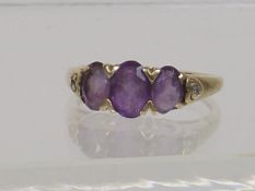 A Ladies 9ct Gold Ring With Amethyst Stones