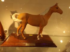 A Mounted Beswick Porcelain Horse