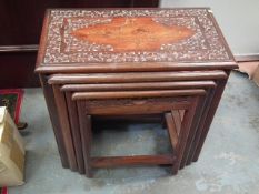 A Set Of Four Hardwood Nest Of Tables With Carved