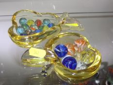 A Small Selection Of Marbles In Glass Bowls