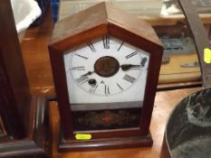 A Small Mahogany Mantle Clock