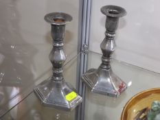A Pair Of George III Paktong Candlesticks