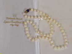 A Set Of Gold & Lapis Lazuli Clasped Pearls With C