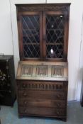 An Oak Bureau Bookcase With Linenfold Decor & Lead