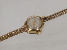 A Ladies Gold Cased Wrist Watch