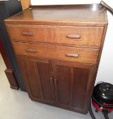 An Oak Utility Cabinet With Two Drawers & Lower Cu